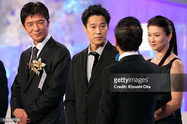Director Izuru Narushima, actor Shinichi Tsutsumi and actress Yui Natsukawa appear on stage during the 34th Japan Academy Awards at Grand Prince...