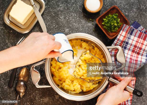 cooking a mashed potatoes - butter making fotografías e imágenes de stock