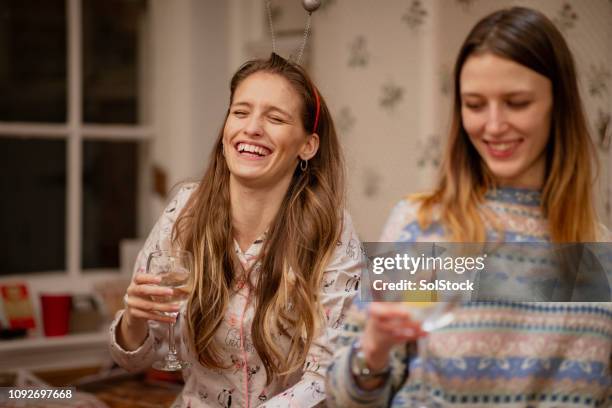 girls at a christmas house party - cocktail and mocktail stock pictures, royalty-free photos & images