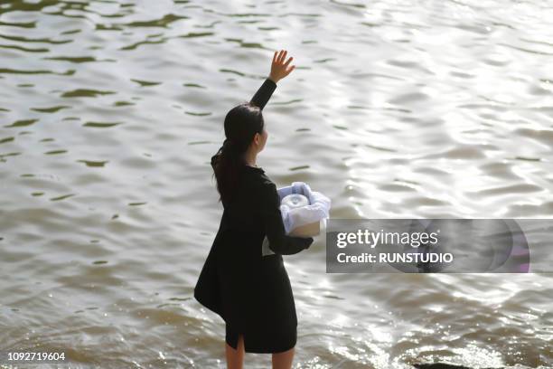 woman grieving with funeral urn - ash bildbanksfoton och bilder