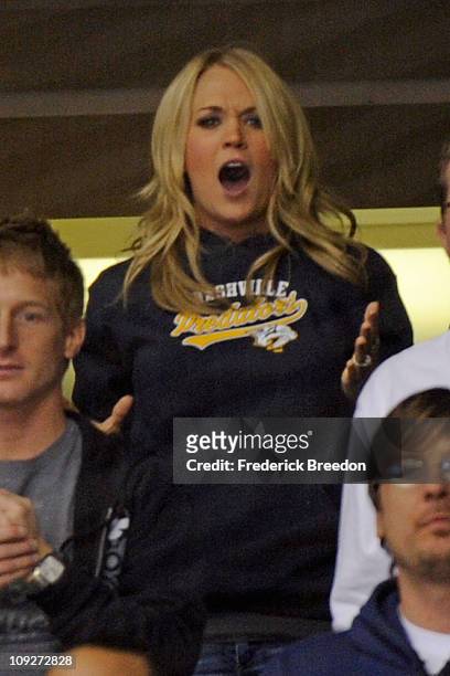 Country singer Carrie Underwood reacts to a questionable referee call while watching the Nashville Predators play against the Vancouver Canucks on...