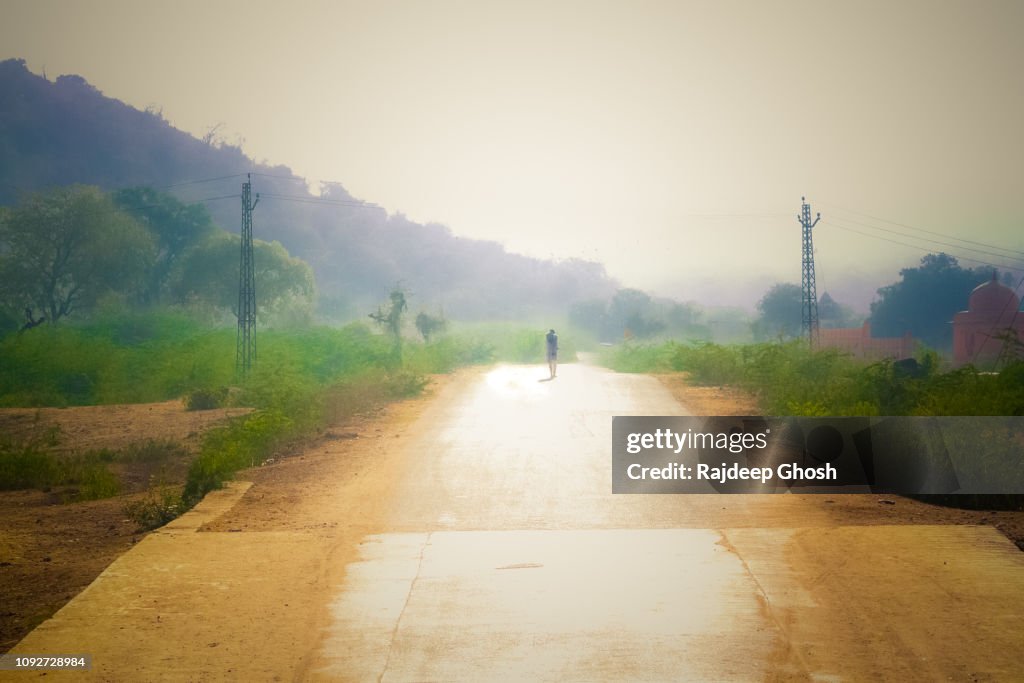 Man walking alone on the road