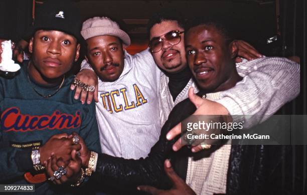 Cool J , Russell Simmons, Heavy D and unidentified pose for a photo at a party for the release of Run DMC's album "Tougher Than Leather" on September...