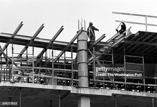 Robert A. Reeder TWP Commerce Executive Park, Reston. BRIEF DESCRIPTION: Construction site in Reston. Construction workers work with the plywood...