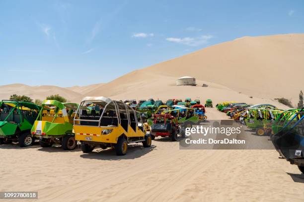 beach buggy on sand dunes in huacachina, peru - huacachina stock pictures, royalty-free photos & images