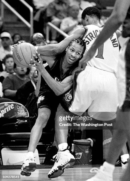 Photographer: Robert A. Reeder TWP MCI brief description: Wizards host 76ers Wizards Rod Strickland ends up with Allen Iverson in a headlock while...