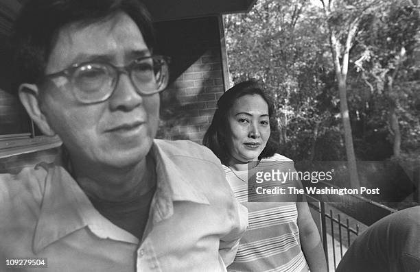 Mr. And Mrs. Phuoc Tran, Vietnamese couple here for almost four years. She works at a Giant Supermarket and he does odd jobs. Photographed at their...