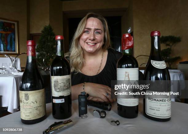 Maureen Downey, fake wine expert, samples bottles of wine at Grissini, Grand Hyatt Hong Kong on February 07, 2017. Bottles of wine Musigny, Cuvee...