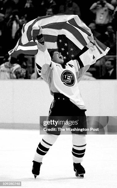 2/98 - PHOTO BY JOEL RICHARDSON,,,, USA BEATS CANADA FOR THE GOLD METAL IN WOMEN'S HOCKEY,,, THE CELEBRATION BEGINS W KARYN BYE HOLDING THE FLAG