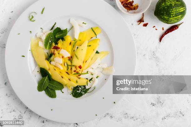 salad with mango, coconut and chilli - mango coconut stock-fotos und bilder