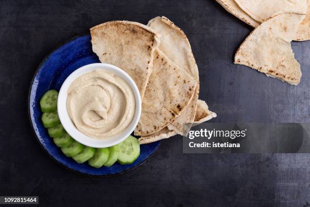 healthy vegan snack, hummus with pita bread and cucumber - pitta bread stock pictures, royalty-free photos & images