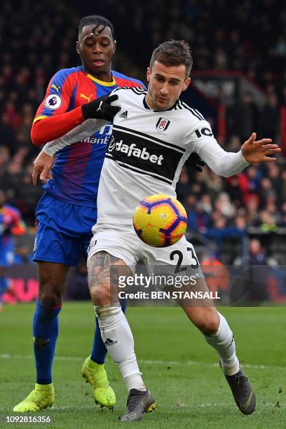 Crystal Palace's English midfielder Aaron Wan-Bissaka vies with Fulham's English defender Joe Bryan during the English Premier League football match...