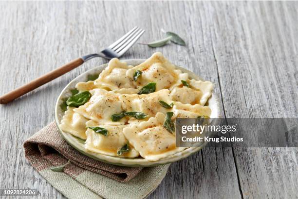 ravioli pasta with sage on a napkin - sage stock pictures, royalty-free photos & images