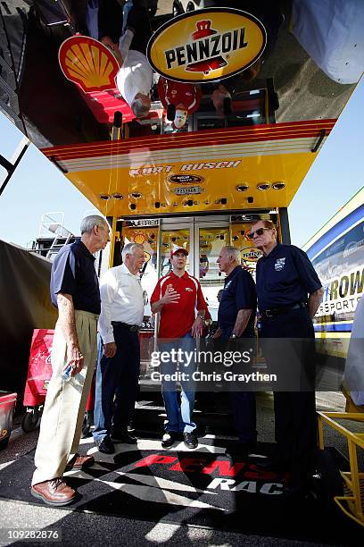 Hall of Famers Ned Jarrett, Bobby Allison, Kurt Busch, driver of the Shell/Pennzoil Dodge, David Pearson and Bud Moore talk in the garage area prior...