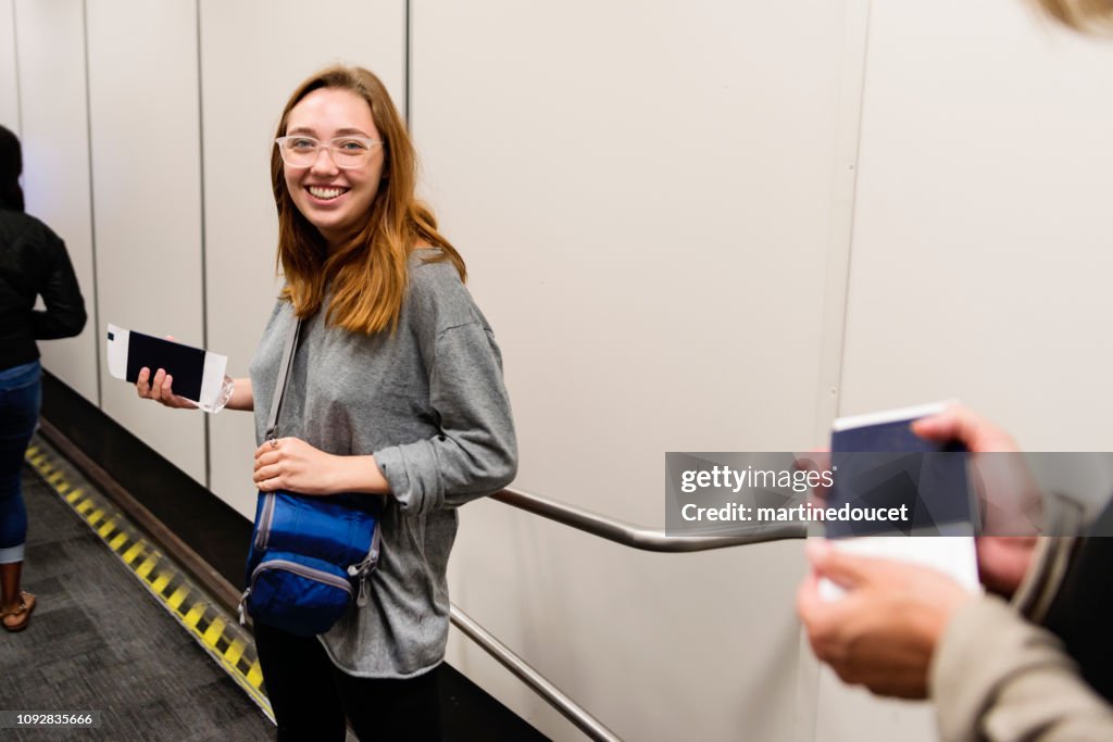 Millennial woman traveling in airport.