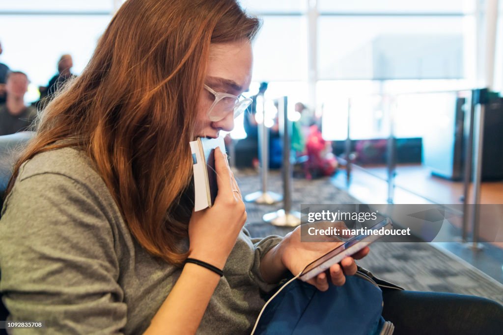 Millennial woman traveling in airport.