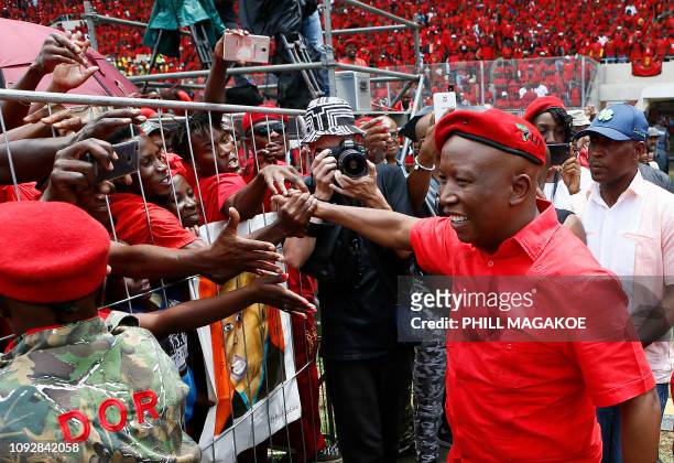 Economic Freedom Fighters leader Julius Malema greets his supporters as he arrives for the party's 2019 Election Manifesto Launch at the Giant...