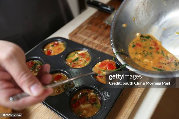 Mobichef's chef Leslie Law Ngai-chun prepares oven-baked Spinach and Tomato Frittata with homemade BBQ Sauce at his home in Kowloon Tong. Mobichef is...