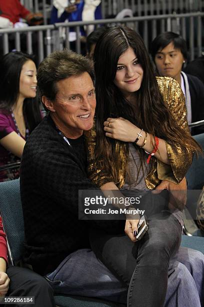 Personality Bruce Jenner and daughter Kylie Kardashian react to a play during the BBVA 2011 NBA All-Star Celebrity Game on center court at Jam...