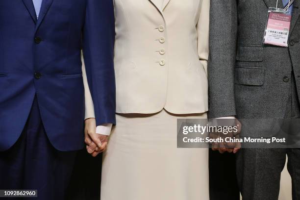 Carrie Lam Cheng Yuet-ngor hand in hand with her husband Lam Siu-por , and their son Jeremy Lam Tsit-sze after Carrie Lam won the Hong Kong Chief...