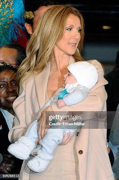 Singer Celine Dion holds her son Nelson Angelil as she arrives at Caesars Palace February 16, 2011 in Las Vegas, Nevada. Dion will begin rehearsals...