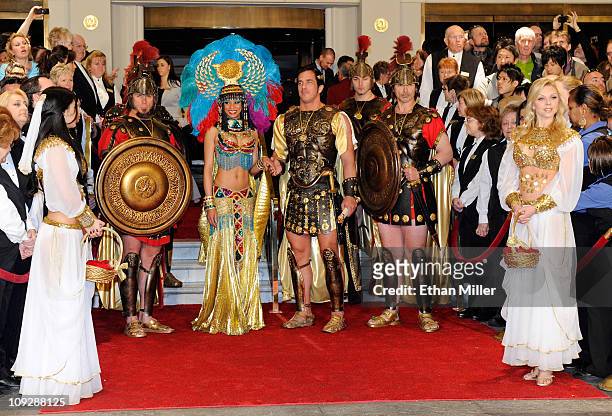 Roman characters including Cleopatra and Julius Caesar and Caesars Palace employees wait for singer Celine Dion to arrive at Caesars Palace February...