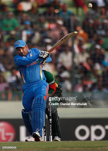 Virender Sehwag of India bats during the opening game of the ICC Cricket World Cup between Bangladesh and India at the Shere-e-Bangla National...