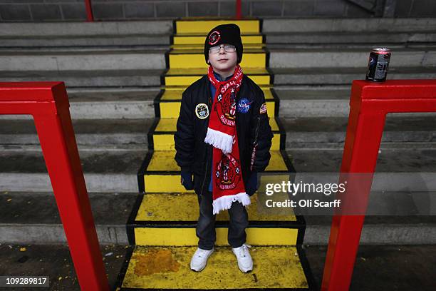 Young fan of the non-league football club Crawley Town poses in Broadfield Stadium before boarding coaches to Manchester to watch their team take on...