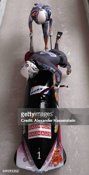 Pilot Sandra Kiriasis and Berit Wiacker of Team Germany 1 starts for the 3rd run of the women's Bobsleigh World Championship on February 19, 2011 in...