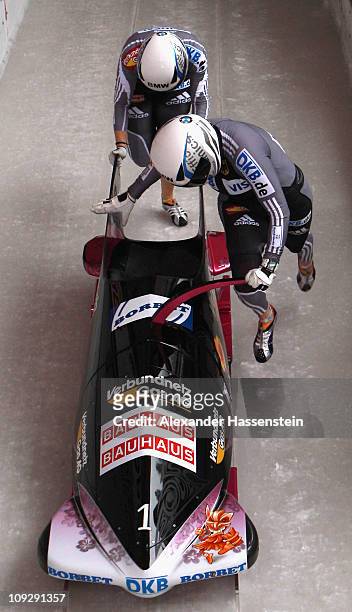 Pilot Sandra Kiriasis and Berit Wiacker of Team Germany 1 starts for the 3rd run of the women's Bobsleigh World Championship on February 19, 2011 in...