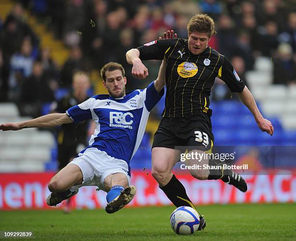 Neil Mellor of Sheffield Wdnesday is tackled by Roger Johnson of Birmingham City during the FA Cup Sponsored by e.on 5th Round match between...