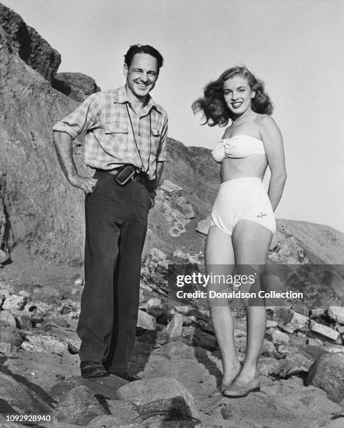 Actress Marilyn Monroe then known as Norma Jeane Mortenson and photographer Richard C. Miller pose for a portrait in 1946 in Los Angeles, California.