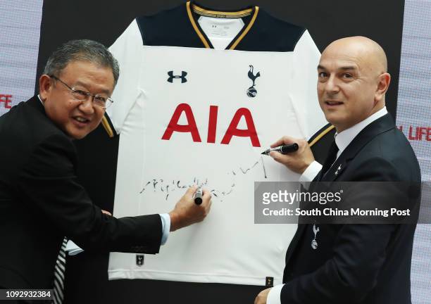 Ng Keng Hooi, Group Chief Executive & President Designate, AIA; Daniel Levy, Chairman, Tottenham Hotspur FC, sign a Spurs shirt; AIA and Tottenham...