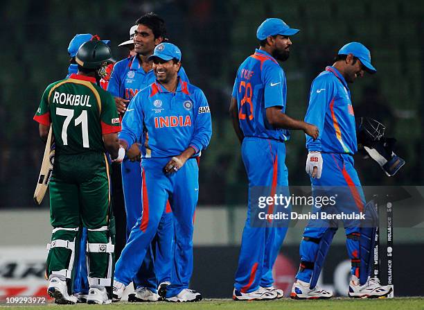 The Indian team celebrate victory over Bangladesh after winning by 87 runs during the opening game of the ICC Cricket World Cup between Bangladesh...