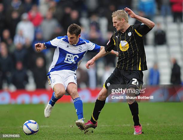 David Bentley of Birmingham City is challenged by Gary Teale of Sheffield Wednesday during the FA Cup Sponsored by e.on 5th Round match between...
