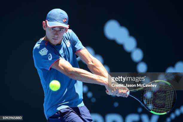 Alex De Minaur of Australia plays a shot in the Mens Singles Semi Final against Gilles Simon of France during day seven of the 2019 Sydney...
