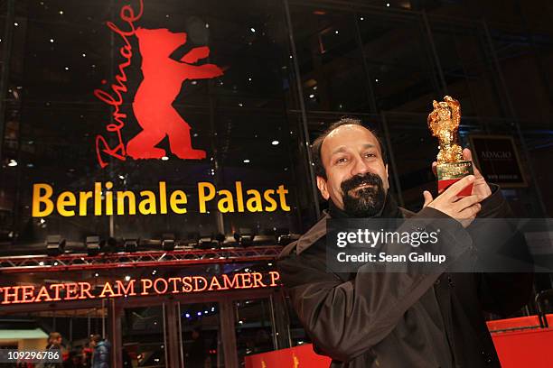 Director Asghar Farhadi of Iranian movie 'Jodaeiye Nader Az Simin' with the Golden Bear for Best Movie during day ten of the 61st Berlin...
