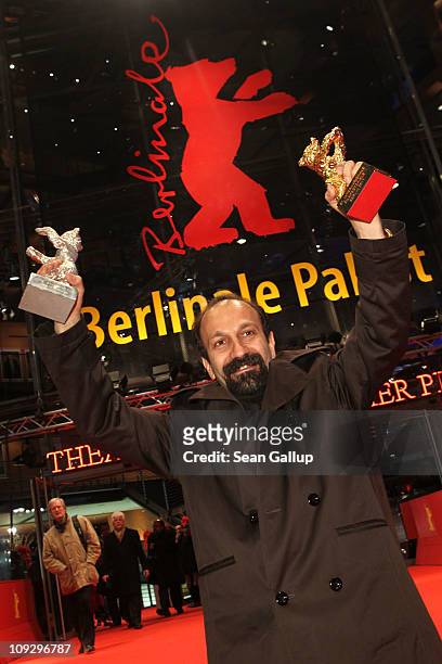 Director Asghar Farhadi of Iranian movie 'Jodaeiye Nader Az Simin' with the Golden Bear for Best Movie during day ten of the 61st Berlin...