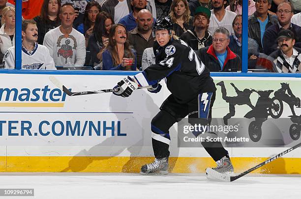 Johan Harju of the Tampa Bay Lightning passes the puck against the Philadelphia Flyers at the St. Pete Times Forum on February 15, 2011 in Tampa,...