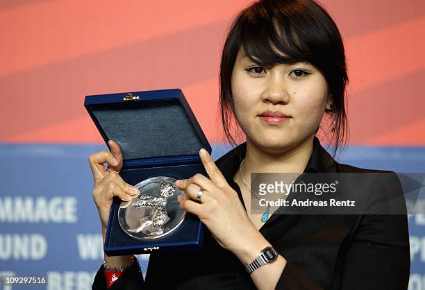 South Korean director Yang Hyo-joo poses with the Silver Bear award of the International Short Film Jury for her film 'The Unbroken' at the Award...