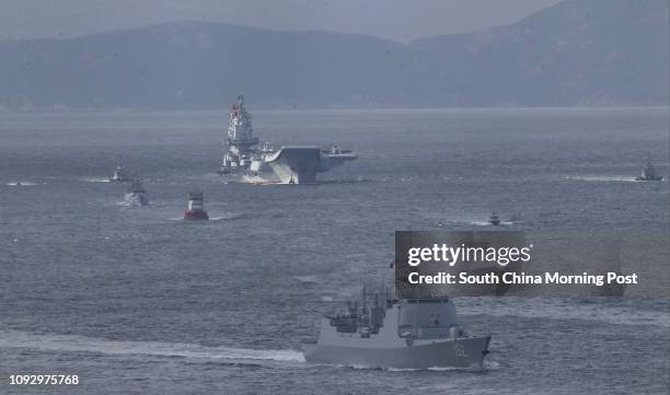 The People's Liberation Army Navy aircraft carrier Liaoning and Type 052C destroyer No. 152 Jinan enter Hong Kong waters from southern Hong Kong....