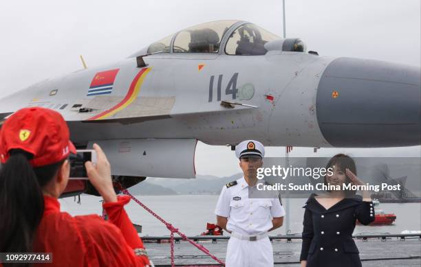 Aircrafts were parked on deck as public visitors with tickets visit the People's Liberation Army Navy aircraft carrier Liaoning on Saturday of July...