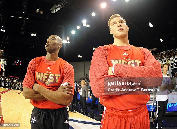 Kobe Bryant of the Los Angeles Lakers stands with Blake Griffin of the Los Angeles Clippers during the East & West All-Star Practice on center Court...