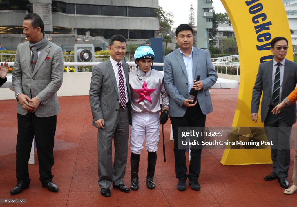 (Centre L to R) Trainer Peter Ho Leung, jockey Silvestre de Sousa and Chua Hwa Por, owner of Limitless celebrate the class 2 win over 1400m at the Sha Tin Racecourse. 19FEB17 SCMP/Kenneth Chan
