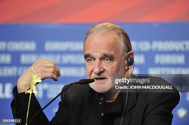 Hungarian director Bela Tarr address a press conference after receiving a silver bear in the "JURY GRAND PRIX" for his movie "The Turin Horse" after...