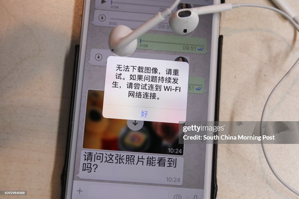 A photo taken of the screen of a smart phone using whatsapp shows a message saying that the receiving photo from another whatsapp user of Xi Jinping and cartoon character Winnie the Pooh could not be downloaded to display on the screen in Beijing on Jul.