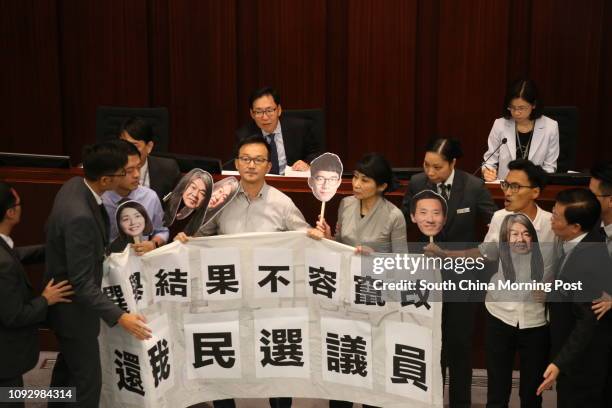 Pro-democratic lawmakers protest at the finance committee of Legislative Council. 19JUL17. SCMP/ David Wong