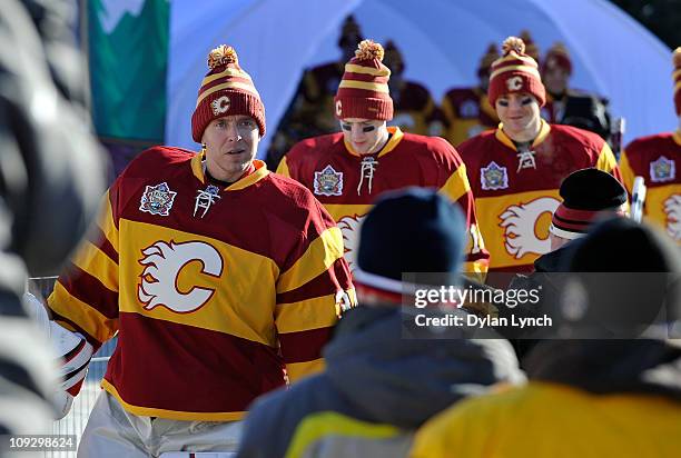 Miikka Kiprusoff of the Calgary Flames leads his team out for the practice session the day before the 2011 NHL Heritage Classic at McMahon Stadium on...