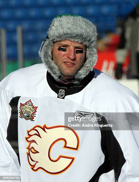 Robyn Regehr of the Calgary Flames sports a Saskatchewan Roughriders hat during the practice session the day before the 2011 NHL Heritage Classic at...