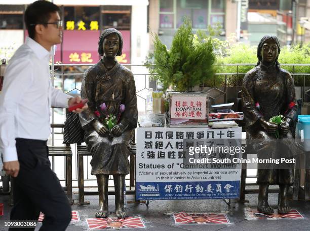 Members of Action Committee for Defending the Diaoyu Islands, place statues of two 'comfort women' near the Japanese consulate in Exchange Square....